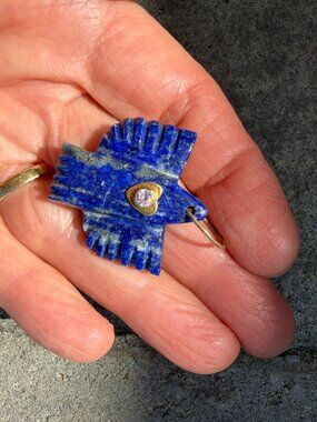 Hand-carved lapis Thunderbird pendant with gold heart and pink sapphire